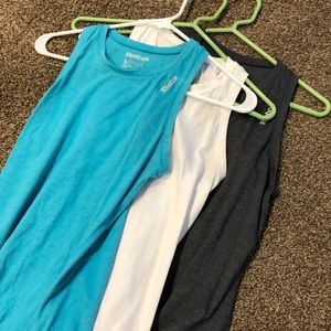 Three sleeveless Reebok tanks